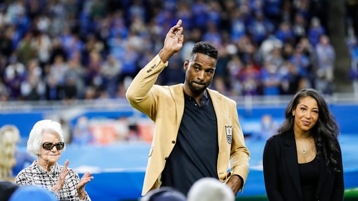 Calvin Johnson waves to Detroit Lions fans as ownership looks on and celebrates his Pro Football Hall of Fame induction 