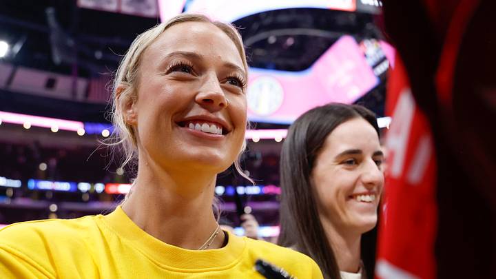 Indiana Fever guards Sophie Cunningham and Caitlin Clark sign autographs.
