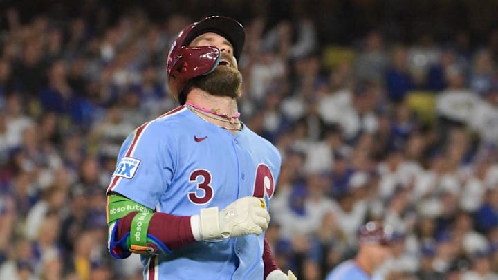 Oct 8, 2025; Los Angeles, California, USA; Philadelphia Phillies first baseman Bryce Harper (3) reacts after lining out during the seventh inning against the Los Angeles Dodgers during game three of the NLDS round for the 2025 MLB playoffs at Dodger Stadium. Oct 8, 2025; Los Angeles, California, USA; Philadelphia Phillies first baseman Bryce Harper (3) reacts after lining out during the seventh inning against the Los Angeles Dodgers during game three of the NLDS round for the 2025 MLB playoffs at Dodger Stadium.