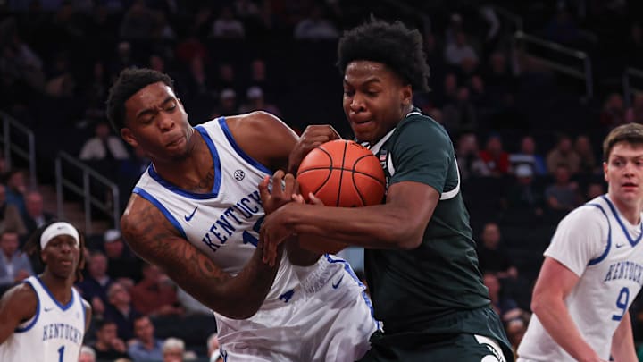 Nov 18, 2025; New York, New York, USA; Kentucky Wildcats forward Brandon Garrison (10) and Michigan State Spartans forward Cameron Ward (3) battle for a rebound during the first half at Madison Square Garden. Mandatory Credit: Vincent Carchietta-Imagn Images
