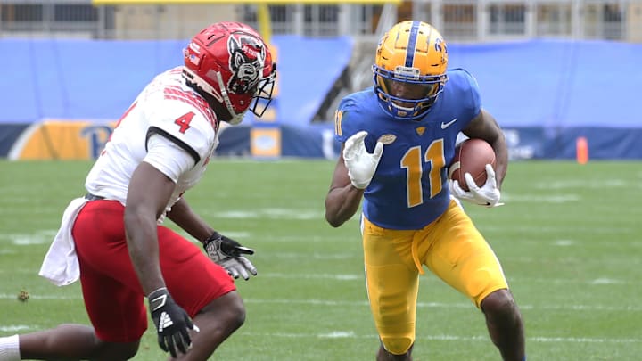 Oct 3, 2020; Pittsburgh, Pennsylvania, USA;  Pittsburgh Panthers wide receiver Taysir Mack (11) runs after a catch against North Carolina State Wolfpack cornerback Cecil Powell (4) during the second quarter at Heinz Field. The Wolfpack won 30-29. Mandatory Credit: Charles LeClaire-Imagn Images