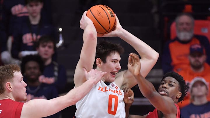 Feb 10, 2026; Champaign, Illinois, USA; Illinois Fighting Illini forward David Mirkovic (0) looks to pass as Wisconsin Badgers forward Austin Rapp (22) and John Blackwell (25) pressure during the second half at State Farm Center. Mandatory Credit: Ron Johnson-Imagn Images Feb 10, 2026; Champaign, Illinois, USA; Illinois Fighting Illini forward David Mirkovic (0) looks to pass as Wisconsin Badgers forward Austin Rapp (22) and John Blackwell (25) pressure during the second half at State Farm Center. Mandatory Credit: Ron Johnson-Imagn Images