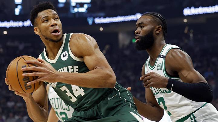 May 13, 2022; Milwaukee, Wisconsin, USA;  Milwaukee Bucks forward Giannis Antetokounmpo (34) looks to shoot against Boston Celtics guard Jaylen Brown (7) during the first quarter during game six of the second round for the 2022 NBA playoffs at Fiserv Forum. Mandatory Credit: Jeff Hanisch-Imagn Images