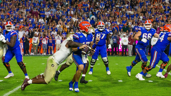 Florida State Seminoles defensive lineman Jared Verse (5) sacks Florida Gators quarterback Max Brown (17) at Steve Spurrier Field at Ben Hill Griffin Stadium in Gainesville, FL on Saturday, November 25, 2023 during the second half. Florida State won 24-15. [Doug Engle/Gainesville Sun]