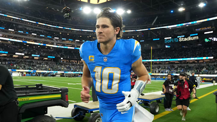 Dec 8, 2025; Inglewood, California, USA; Los Angeles Chargers quarterback Justin Herbert (10) runs off field after defeating the Philadelphia Eagles in overtime at SoFi Stadium. Mandatory Credit: Kirby Lee-Imagn Images