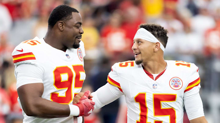 Aug 9, 2025; Glendale, Arizona, USA; Kansas City Chiefs defensive tackle Chris Jones (95) with quarterback Patrick Mahomes (15) against the Arizona Cardinals during a preseason NFL game at State Farm Stadium. Mandatory Credit: Mark J. Rebilas-Imagn Images