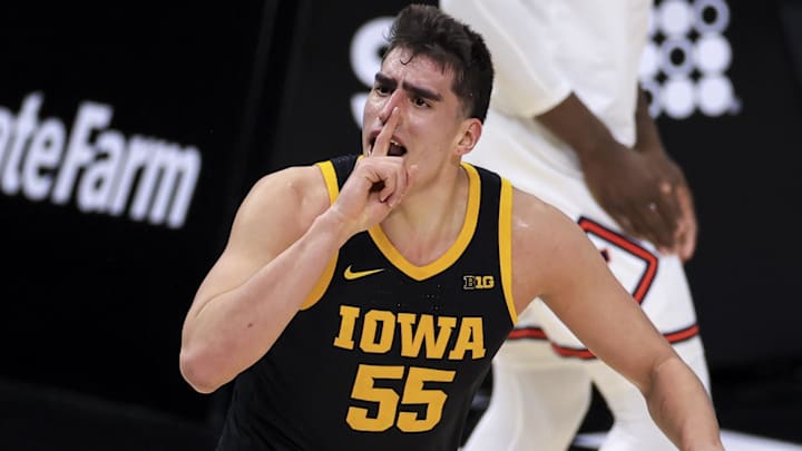 Mar 13, 2021; Indianapolis, Indiana, USA; Iowa Hawkeyes center Luka Garza (55) reacts to the crowd after making a shot against the Illinois Fighting Illini in the first half at Lucas Oil Stadium. Mandatory Credit: Aaron Doster-Imagn Images