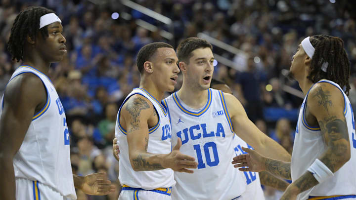 Feb 8, 2025; Los Angeles, California, USA; UCLA Bruins forward William Kyle III (24), guard Kobe Johnson (0), guard Lazar Stefanovic (10) and guard Skyy Clark (55) on the court after a basket in the second half against the Penn State Nittany Lions at Pauley Pavilion presented by Wescom. Mandatory Credit: Jayne Kamin-Oncea-Imagn Images