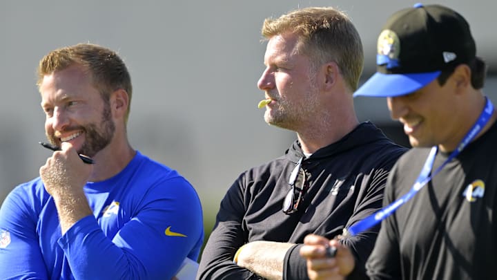 Jul 29, 2024; Los Angeles, CA, USA; Los Angeles Rams head coach Sean McVay, general manager Les Snead and chief of staff Carter Crutchfield talk on the field during training camp at Loyola Marymount University. Mandatory Credit: Jayne Kamin-Oncea-Imagn Images