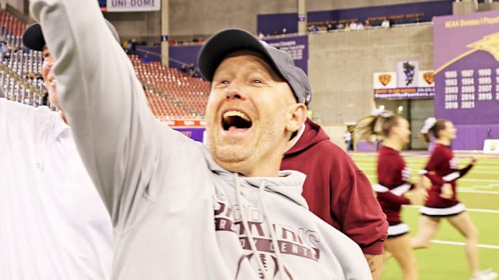 Grundy Center Head Coach Travis Zajac celebrates two State Championships as the MFL MarMac Bulldogs compete against the Grundy Center Spartans for the Class 1A championship on Thursday, November 16, 2023 at the UNI-Dome in Cedar Falls.