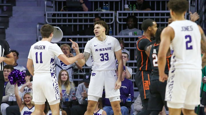 Jan 29, 2025; Manhattan, Kansas, USA; Kansas State Wildcats forward Coleman Hawkins (33) and guard Brendan Hausen (11) celebrate a play during the first half against the Oklahoma State Cowboys at Bramlage Coliseum. Mandatory Credit: Scott Sewell-Imagn Images