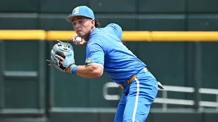Jun 14, 2025; Omaha, Neb, USA;  UCLA Bruins shortstop Roch Cholowsky (1) completes a double play against the Murray State Racers during the second inning at Charles Schwab Field. Mandatory Credit: Steven Branscombe-Imagn Images