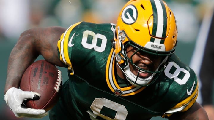 Green Bay Packers running back Josh Jacobs bursts through a hole against the Cardinals last season. Green Bay Packers running back Josh Jacobs bursts through a hole against the Cardinals last season.
