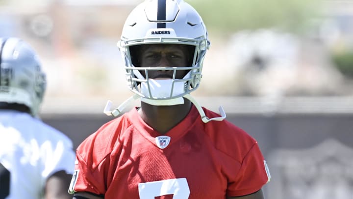 Jun 10, 2025; Henderson, NV, USA; Las Vegas Raiders quarterback Geno Smith (7) looks on during the team stretch during Las Vegas Raiders Minicamp at Intermountain Health Performance Center. Mandatory Credit: Candice Ward-Imagn Images