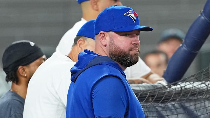 Jun 30, 2025; Toronto, Ontario, CAN; Toronto Blue Jays manager John Schneider (14) watches batting practice before a game against the New York Yankees at Rogers Centre.