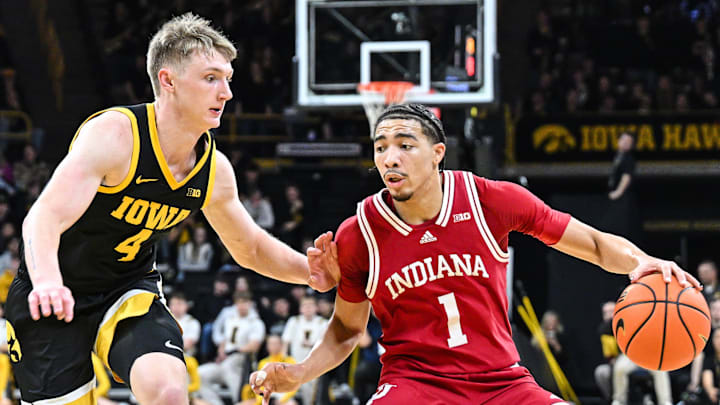 Indiana guard Myles Rice (1) dribbles against Iowa guard Josh Dix (4) at Carver-Hawkeye Arena. 