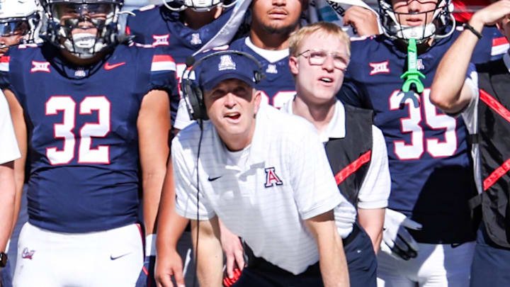 Nov 8, 2025; Tucson, Arizona, USA; Arizona Wildcats head coach Brent Brennan watches the game from the sidelines during the first quarter against the Kansas Jayhawks at Arizona Stadium. Mandatory Credit: Aryanna Frank-Imagn Images