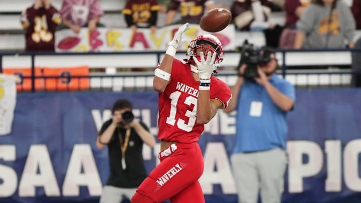 Xavier Watson makes the catch for a Waverly touchdown during the Wolverines' 46-26 win over Fonda-Fultonville in the NYSPHSAA Class C football final Dec. 2, 2023 at the JMA Wireless Dome in Syracuse.