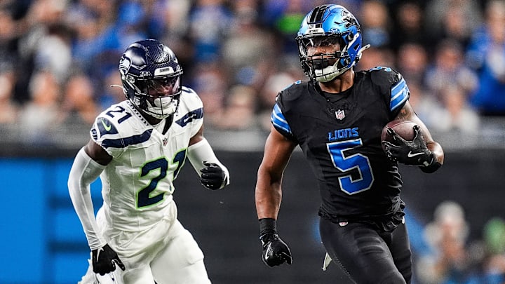 Sep 30, 2024; Detroit, MI, USA; Detroit Lions running back David Montgomery (5) runs against Seattle Seahawks cornerback Devon Witherspoon (21) during the first half at Ford Field in Detroit on Monday, Sept. 30, 2024. Sep 30, 2024; Detroit, MI, USA; Detroit Lions running back David Montgomery (5) runs against Seattle Seahawks cornerback Devon Witherspoon (21) during the first half at Ford Field in Detroit on Monday, Sept. 30, 2024.