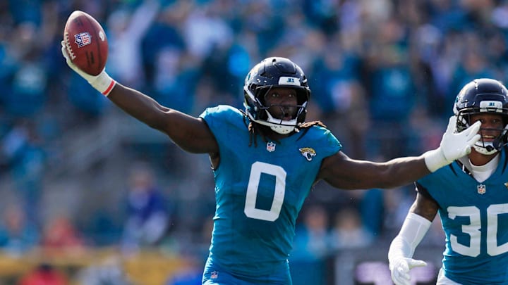 Jacksonville Jaguars linebacker Devin Lloyd (0) reacts to a fumble recovery next to cornerback Montaric Brown (30) during the second quarter of an NFL football AFC Wild Card playoff matchup, Sunday, Jan. 11, 2026, in Jacksonville, Fla. The Bills defeated the Jaguars 27-24. [Corey Perrine/Florida Times-Union]