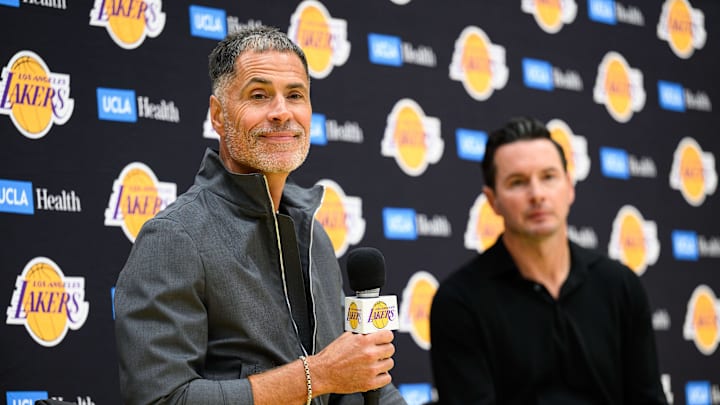 Sep 25, 2025; El Segundo, CA, USA; Los Angeles Lakers general manager Rob Pelinka, left, speaks during a press conference to preview the 2025-26 season at UCLA Health Training Center. Mandatory Credit: William Liang-Imagn Images