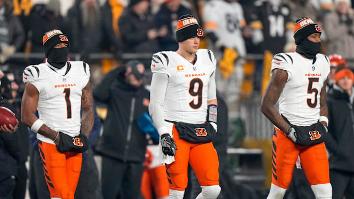 Cincinnati Bengals wide receiver Ja'Marr Chase (1), quarterback Joe Burrow (9) and wide receiver Tee Higgins (5) take the field as captains for the coin toss before the first quarter of the NFL Week 18 game between the Pittsburgh Steelers and the Cincinnati Bengals at Acrisure Stadium in Pittsburgh on Saturday, Jan. 4, 2025.