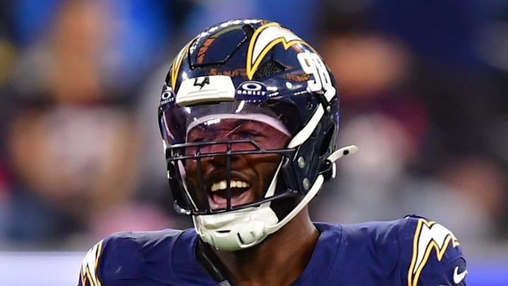 Dec 27, 2025; Inglewood, California, USA; Los Angeles Chargers linebacker Odafe Oweh (98) and linebacker Daiyan Henley (0) react after a defensive play against the Houston Texans during the second half at SoFi Stadium. Mandatory Credit: Gary A. Vasquez-Imagn Images Dec 27, 2025; Inglewood, California, USA; Los Angeles Chargers linebacker Odafe Oweh (98) and linebacker Daiyan Henley (0) react after a defensive play against the Houston Texans during the second half at SoFi Stadium. Mandatory Credit: Gary A. Vasquez-Imagn Images