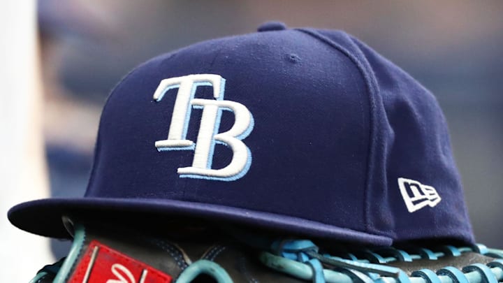 Sep 6, 2019; St. Petersburg, FL, USA; A detail view of a Tampa Bay Rays hat and glove at Tropicana Field. 