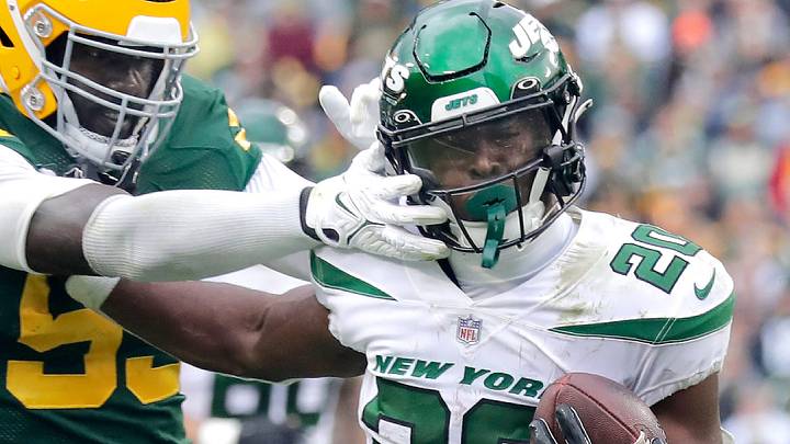 New York Jets running back Breece Hall runs the ball against Packers linebacker De'Vondre Campbell in 2022. New York Jets running back Breece Hall runs the ball against Packers linebacker De'Vondre Campbell in 2022.