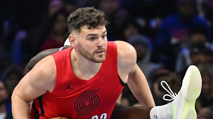 Mar 15, 2026; Philadelphia, Pennsylvania, USA; Portland Trail Blazers center Donovan Clingan (23) grabs the rebound against Philadelphia 76ers center Adem Bona (30) during the first half at Xfinity Mobile Arena. Mandatory Credit: Eric Hartline-Imagn Images