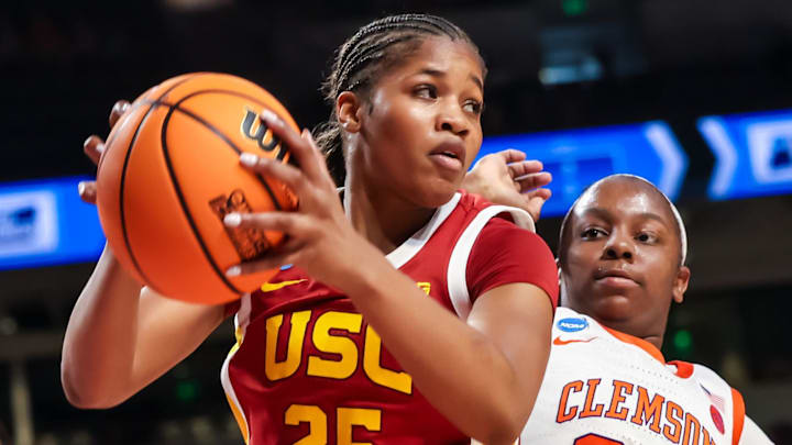 Mar 21, 2026; Columbia, South Carolina, USA; USC Trojans guard Kara Dunn (25) grabs a rebound in front of Clemson Tigers forward Raven Thompson (32) in the first half at Colonial Life Arena. Mandatory Credit: Jeff Blake-Imagn Images Mar 21, 2026; Columbia, South Carolina, USA; USC Trojans guard Kara Dunn (25) grabs a rebound in front of Clemson Tigers forward Raven Thompson (32) in the first half at Colonial Life Arena. Mandatory Credit: Jeff Blake-Imagn Images