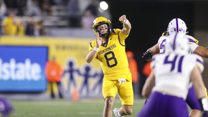 Sep 7, 2024; Morgantown, West Virginia, USA; West Virginia Mountaineers quarterback Nicco Marchiol (8) throws a pass during the fourth quarter against the Albany Great Danes at Mountaineer Field at Milan Puskar Stadium. Mandatory Credit: Ben Queen-Imagn Images
