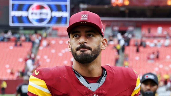 Washington Commanders quarterback Marcus Mariota walks off the field after the game against Las Vegas Raiders.
