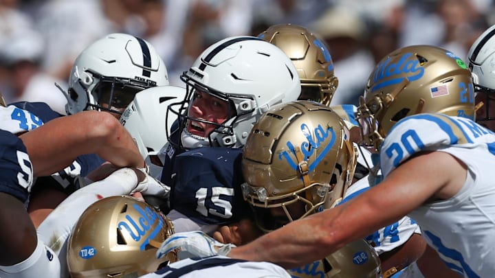 Oct 5, 2024; University Park, Pennsylvania, USA; Penn State Nittany Lions quarterback Drew Allar (15) pushes his way into the end zone for a touchdown during the second quarter against the UCLA Bruins at Beaver Stadium. Mandatory Credit: Matthew O'Haren-Imagn Images