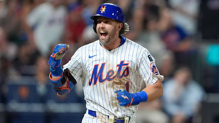 Aug 25, 2025; New York City, New York, USA; New York Mets second baseman Jeff McNeil (1) reacts to hitting an RBI single against the Philadelphia Phillies during the fourth inning at Citi Field. Mandatory Credit: Gregory Fisher-Imagn Images