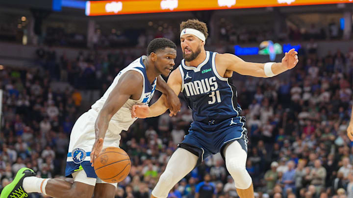 Oct 29, 2024; Minneapolis, Minnesota, USA; Minnesota Timberwolves guard Anthony Edwards (5) dribbles against Dallas Mavericks guard Klay Thompson (31) in the first quarter at Target Center. Mandatory Credit: Brad Rempel-Imagn Images