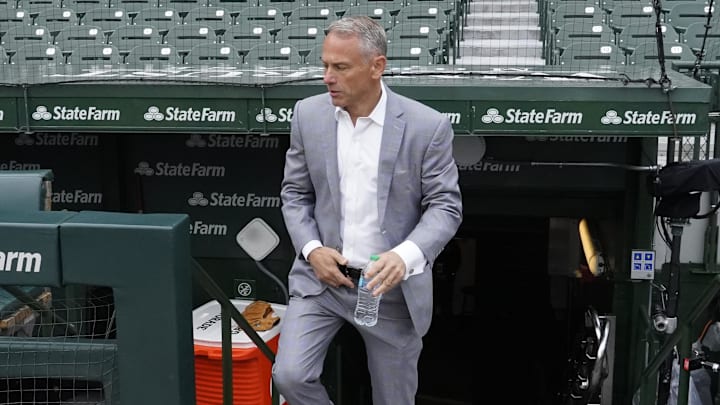 Apr 4, 2025; Chicago, Illinois, USA; Jed Hoyer President of the Chicago Cubs walks onto the field before a game against the San Diego Padres at Wrigley Field. 