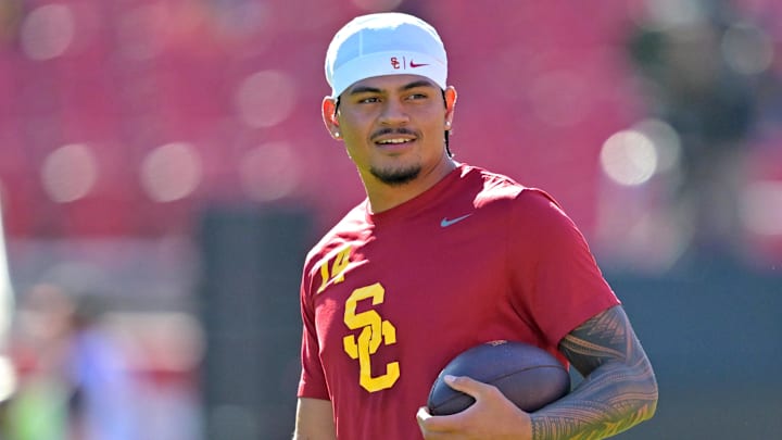 Oct 11, 2025; Los Angeles, California, USA;  USC Trojans quarterback Jayden Maiava (14) warms up prior to the game against the Michigan Wolverines at United Airlines Field at the Los Angeles Memorial Coliseum. 
