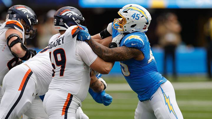 INGLEWOOD, CA - SEPTEMBER 21: Los Angeles Chargers linebacker Tuli Tuipulotu 45 locks up with Denver Broncos offensive tackle Mike McGlinchey 69 during the NFL, American Football Herren, USA game between the Denver Broncos and the Los Angeles Chargers on September 21, 2025, at SoFi Stadium in Inglewood, CA. INGLEWOOD, CA - SEPTEMBER 21: Los Angeles Chargers linebacker Tuli Tuipulotu 45 locks up with Denver Broncos offensive tackle Mike McGlinchey 69 during the NFL, American Football Herren, USA game between the Denver Broncos and the Los Angeles Chargers on September 21, 2025, at SoFi Stadium in Inglewood, CA.