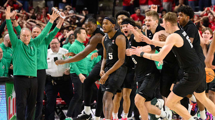 Feb 26, 2025; College Park, Maryland, USA; Michigan State Spartans guard Tre Holloman (5) celebrates with teammates after making a shot to end the game against the Maryland Terrapins at Xfinity Center. Mandatory Credit: Reggie Hildred-Imagn Images