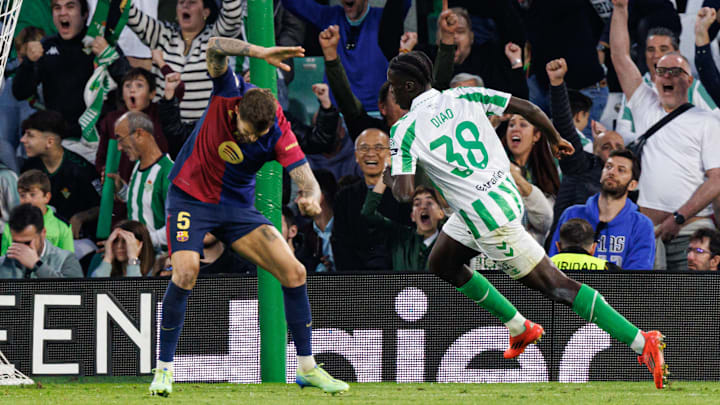 Íñigo Martínez (left) slaps the ground in frustration after Barcelona gave up the equalizer in the 94th minute of the match.