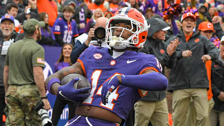Clemson Tigers cornerback Shelton Lewis (14) returns an interception for a touchdown against the Georgia Tech Yellow Jackets during the fourth quarter at Memorial Stadium.