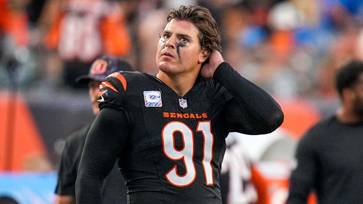 Cincinnati Bengals defensive end Trey Hendrickson (91) watches a replay as the Detroit Lions celebrate a touchdown in the fourth quarter of the NFL Week 5 game between the Cincinnati Bengals and the Detroit Lions at Paycor Stadium in downtown Cincinnati on Sunday, Oct. 5, 2025. The Bengals continued a losing streak, falling 37-24 to the Lions. Cincinnati Bengals defensive end Trey Hendrickson (91) watches a replay as the Detroit Lions celebrate a touchdown in the fourth quarter of the NFL Week 5 game between the Cincinnati Bengals and the Detroit Lions at Paycor Stadium in downtown Cincinnati on Sunday, Oct. 5, 2025. The Bengals continued a losing streak, falling 37-24 to the Lions.