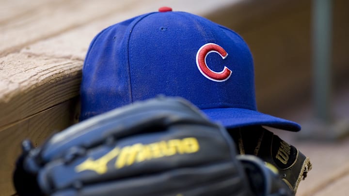 June 9, 2010; Milwaukee, WI, USA; Chicago Cubs hat and glove in the dugout prior to the game against the Milwaukee Brewers at Miller Park. The Cubs defeated the Brewers 9-4. Mandatory Credit: Jeff Hanisch-Imagn Images June 9, 2010; Milwaukee, WI, USA; Chicago Cubs hat and glove in the dugout prior to the game against the Milwaukee Brewers at Miller Park. The Cubs defeated the Brewers 9-4. Mandatory Credit: Jeff Hanisch-Imagn Images