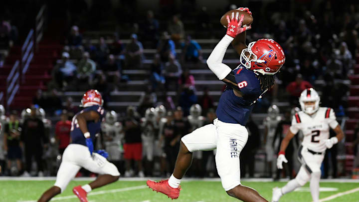 Manatee's wide receiver Torey Gilley scores a touchdown last week against Palmetto. Manatee's wide receiver Torey Gilley scores a touchdown last week against Palmetto.