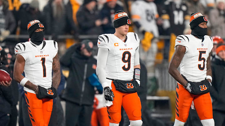 Cincinnati Bengals wide receiver Ja'Marr Chase (1), quarterback Joe Burrow (9) and wide receiver Tee Higgins (5) take the field as captains for the coin toss before the first quarter of the NFL Week 18 game between the Pittsburgh Steelers and the Cincinnati Bengals at Acrisure Stadium in Pittsburgh on Saturday, Jan. 4, 2025. Cincinnati Bengals wide receiver Ja'Marr Chase (1), quarterback Joe Burrow (9) and wide receiver Tee Higgins (5) take the field as captains for the coin toss before the first quarter of the NFL Week 18 game between the Pittsburgh Steelers and the Cincinnati Bengals at Acrisure Stadium in Pittsburgh on Saturday, Jan. 4, 2025.