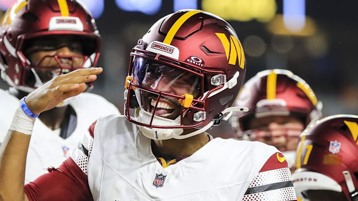 Sep 23, 2024; Cincinnati, Ohio, USA; Washington Commanders quarterback Jayden Daniels (5) reacts after scoring a touchdown against the Cincinnati Bengals in the first half at Paycor Stadium. Mandatory Credit: Katie Stratman-Imagn Images Sep 23, 2024; Cincinnati, Ohio, USA; Washington Commanders quarterback Jayden Daniels (5) reacts after scoring a touchdown against the Cincinnati Bengals in the first half at Paycor Stadium. Mandatory Credit: Katie Stratman-Imagn Images
