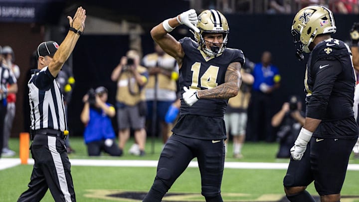 Sep 14, 2025; New Orleans, Louisiana, USA; New Orleans Saints wide receiver Devaughn Vele (14) reacts to scoring a touchdown against San Francisco 49ers safety Jason Pinnock (25) during the second half at Caesars Superdome. Mandatory Credit: Stephen Lew-Imagn Images Sep 14, 2025; New Orleans, Louisiana, USA; New Orleans Saints wide receiver Devaughn Vele (14) reacts to scoring a touchdown against San Francisco 49ers safety Jason Pinnock (25) during the second half at Caesars Superdome. Mandatory Credit: Stephen Lew-Imagn Images