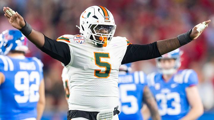 Jan 8, 2026; Glendale, AZ, USA; Miami Hurricanes defensive lineman Justin Scott (5) against the Mississippi Rebels during the 2026 Fiesta Bowl and semifinal game of the College Football Playoff at State Farm Stadium. Mandatory Credit: Mark J. Rebilas-Imagn Images Jan 8, 2026; Glendale, AZ, USA; Miami Hurricanes defensive lineman Justin Scott (5) against the Mississippi Rebels during the 2026 Fiesta Bowl and semifinal game of the College Football Playoff at State Farm Stadium. Mandatory Credit: Mark J. Rebilas-Imagn Images