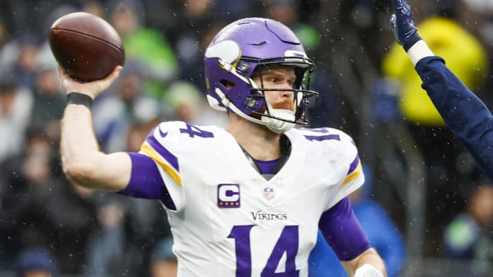 Dec 22, 2024; Seattle, Washington, USA; Minnesota Vikings quarterback Sam Darnold (14) passes against the Seattle Seahawks during the second quarter at Lumen Field. Mandatory Credit: Joe Nicholson-Imagn Images